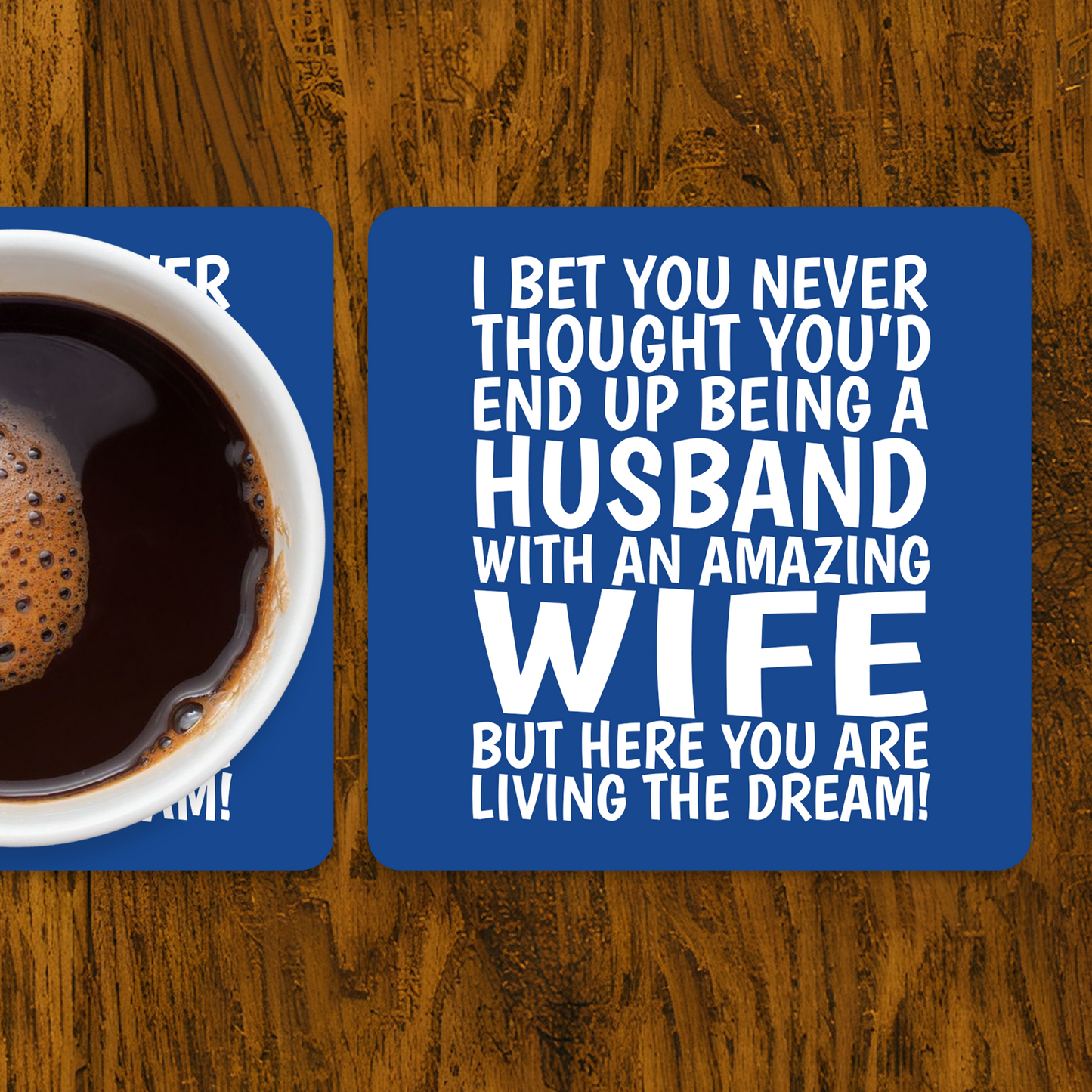 Funny blue coaster for husband with quote “I bet you never thought you’d end up being a husband with an amazing wife.” With mug of coffee