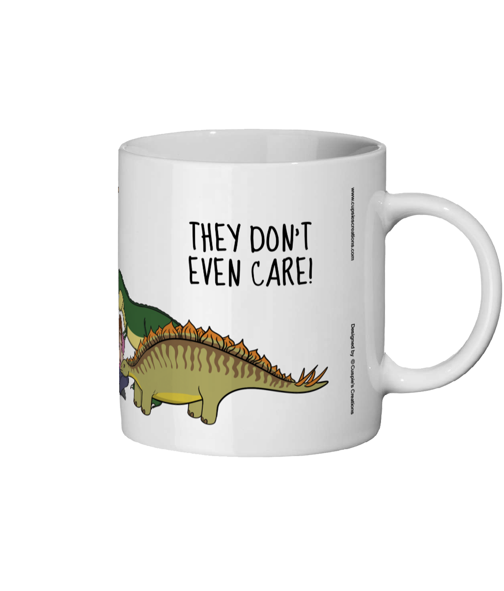 White mug with a dinosaur graphic and text 'THEY DON'T EVEN CARE!' on a white background