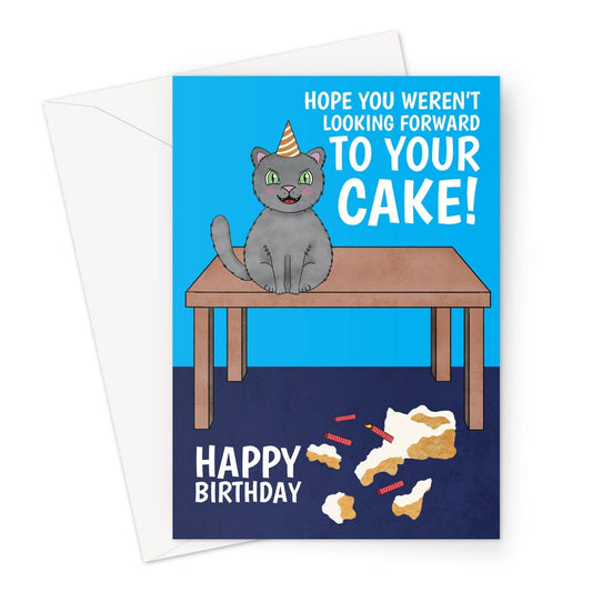A funny birthday card with an illsutration of a black pet cat smashing a birthday cake.
