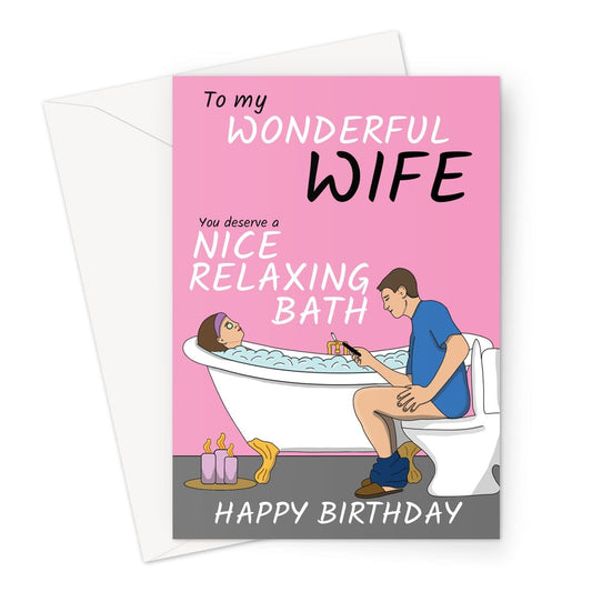 A funny birthday card for a Wife. Featuring a woman relaxing in a bath whilst her husband is on the toilet next to her.