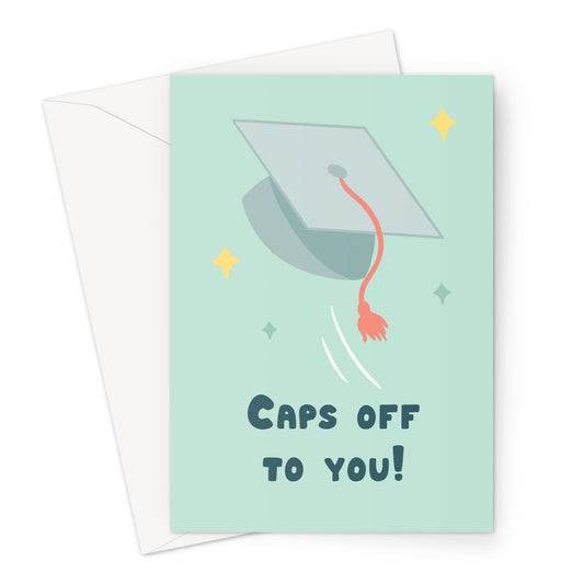 Caps off to you greeting card with illustrated graduation cap flying on a pastel green background