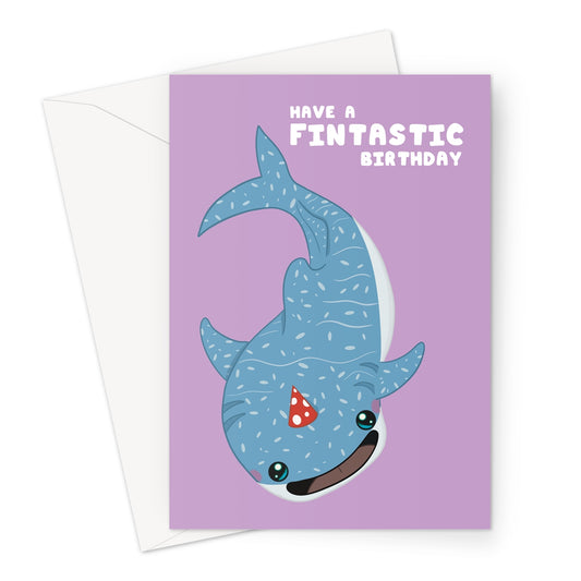 Cute whale shark birthday card wearing a party hat with fintastic birthday message on purple background