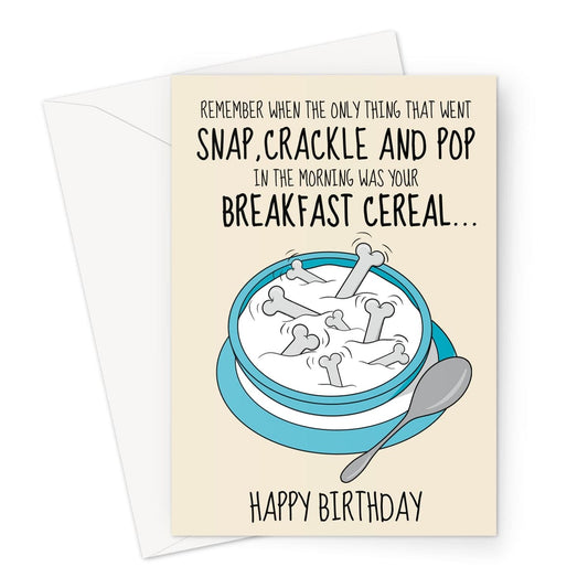 Funny birthday card with a cereal bowl illustration and a joke about ageing. The text reads: "Remember when the only thing that went snap, crackle and pop in the morning was your breakfast cereal... Happy Birthday."
