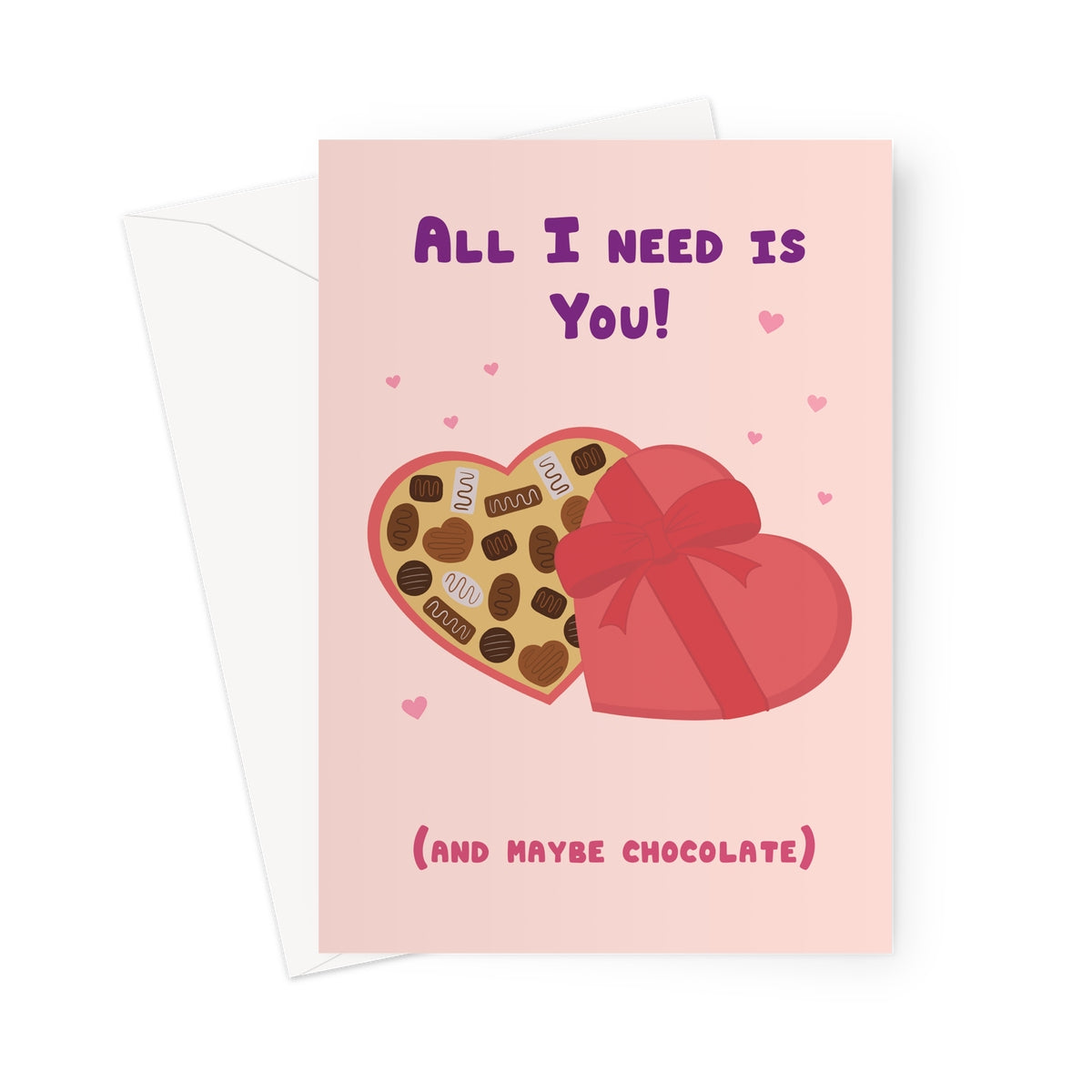All I need is you greeting card with heart shaped chocolate box and pink hearts on a pastel background