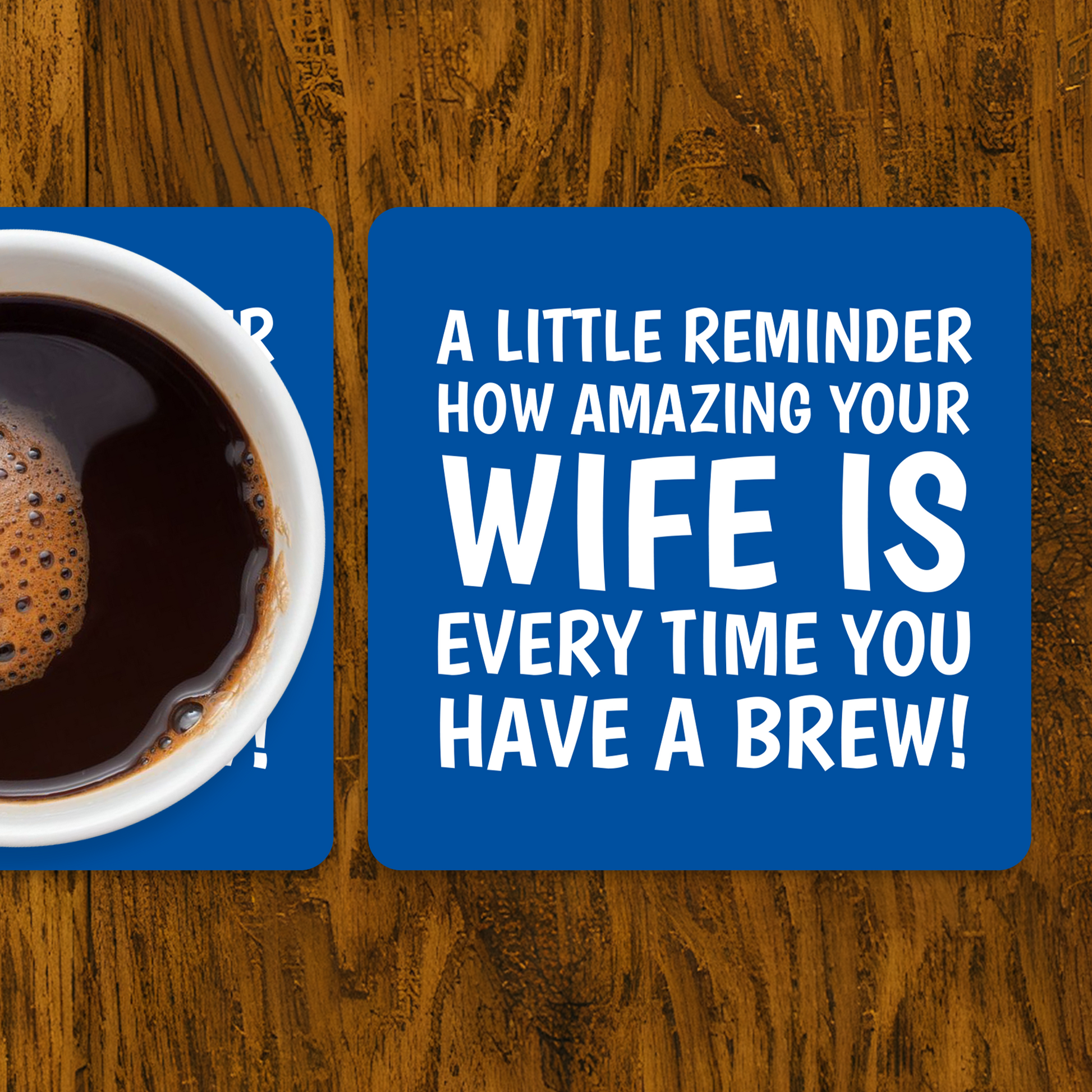 Coaster with coffee and humorous text on a wooden surface