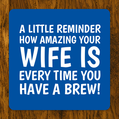 Blue coaster with white text saying “A little reminder how amazing your husband is every time you have a brew!” — gift from wife to husband.