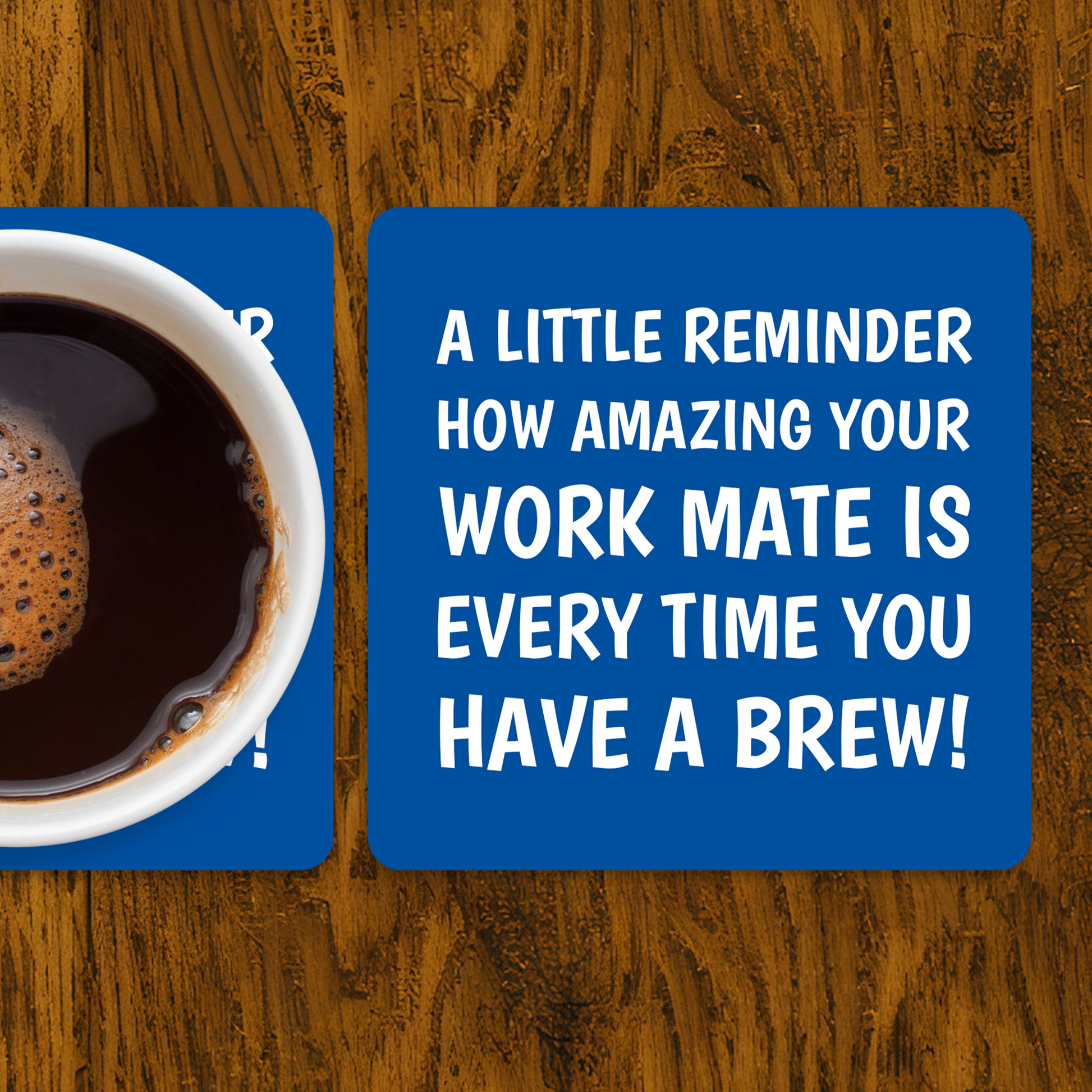 Coffee cup on a coaster with a humorous message on a wooden surface