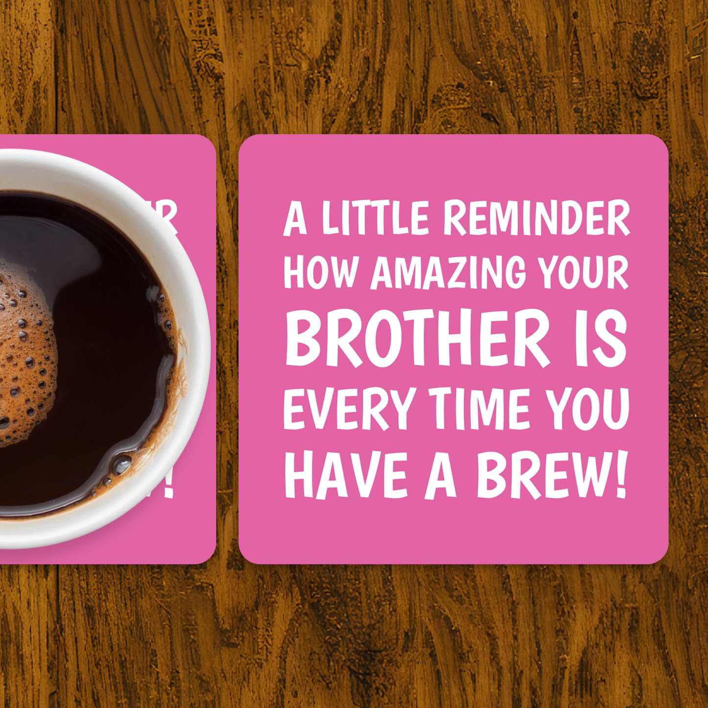 Coffee cup on a pink coaster with a humorous message on a wooden surface