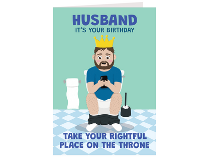 A humorous birthday card featuring a cartoon illustration of a bearded man sitting on a toilet using his phone, wearing a gold crown. The card has a light teal background with blue text reading 'HUSBAND IT'S YOUR BIRTHDAY' at the top and 'TAKE YOUR RIGHTFUL PLACE ON THE THRONE' at the bottom.