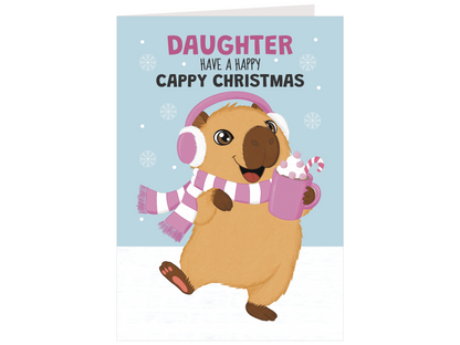 A greeting card featuring a cartoon beaver wearing pink and white earmuffs and a striped scarf, holding a mug with whipped cream and a candy cane. The card reads 'DAUGHTER HAVE A HAPPY CAPPY CHRISTMAS' on a light blue background with snowflakes.