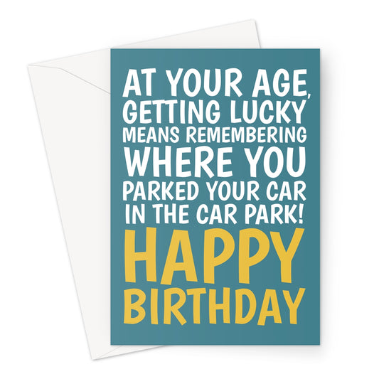 Funny teal birthday card with yellow text saying “At your age, getting lucky means remembering where you parked your car in the car park! Happy Birthday.”