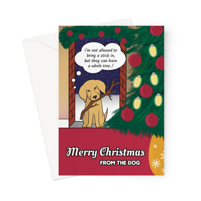 Funny Christmas card from the dog featuring a cute Labrador holding a stick and saying “I’m not allowed to bring a stick in, but they can have a whole tree..!” with a decorated Christmas tree beside him.