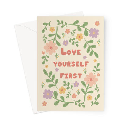 Love yourself first greeting card with pastel flowers and leaves on a cream background