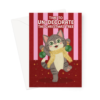 funny cat Christmas card with cat wearing tinsel holding baubles and un-decorate the Christmas tree message