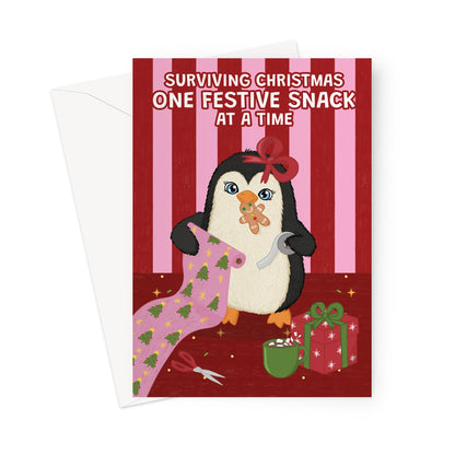 funny Christmas card with cute penguin wrapping presents and eating festive snacks