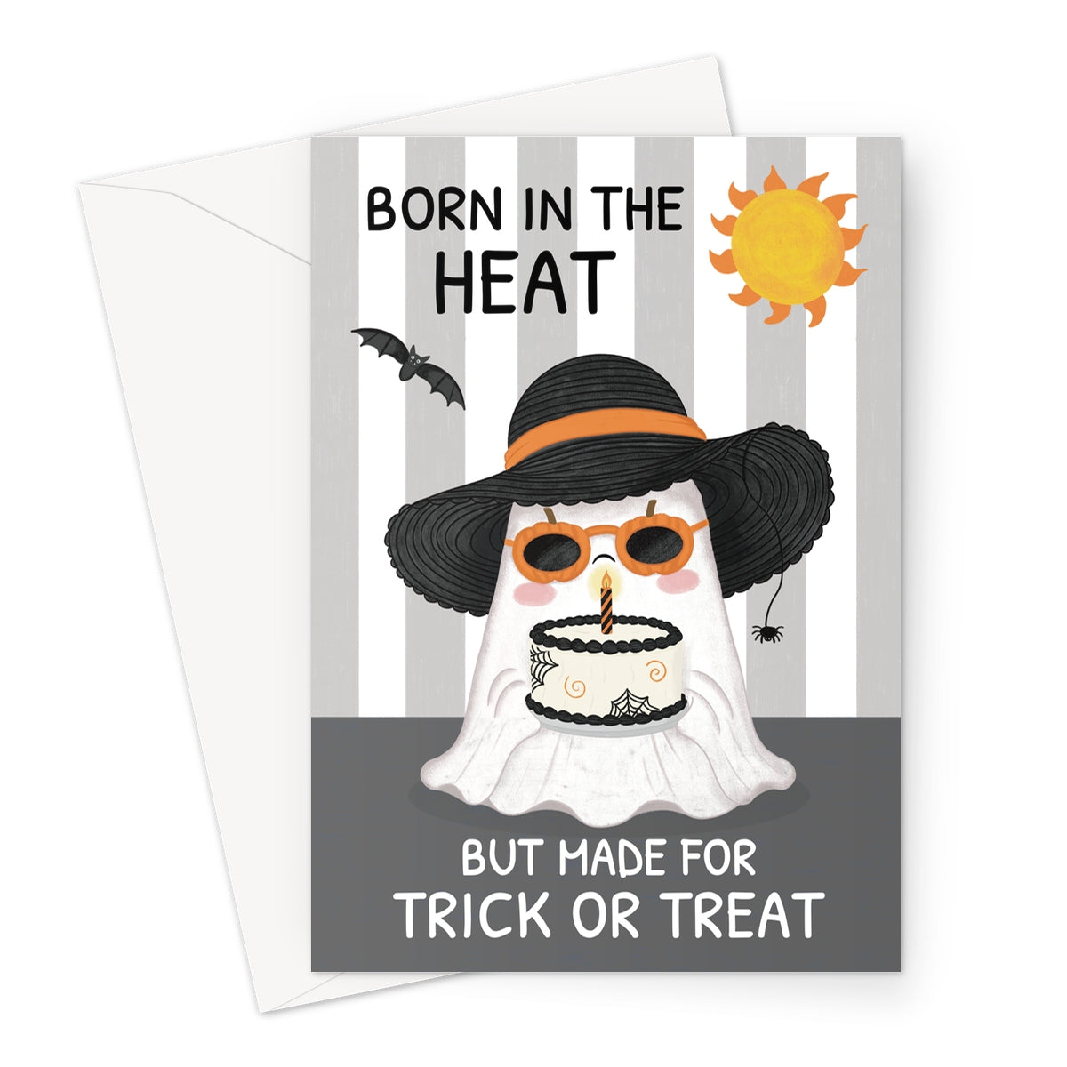 A Halloween greeting card with a white envelope behind it. The card features a ghost character wearing a black witch hat with an orange band and orange sunglasses, holding a small cake.
