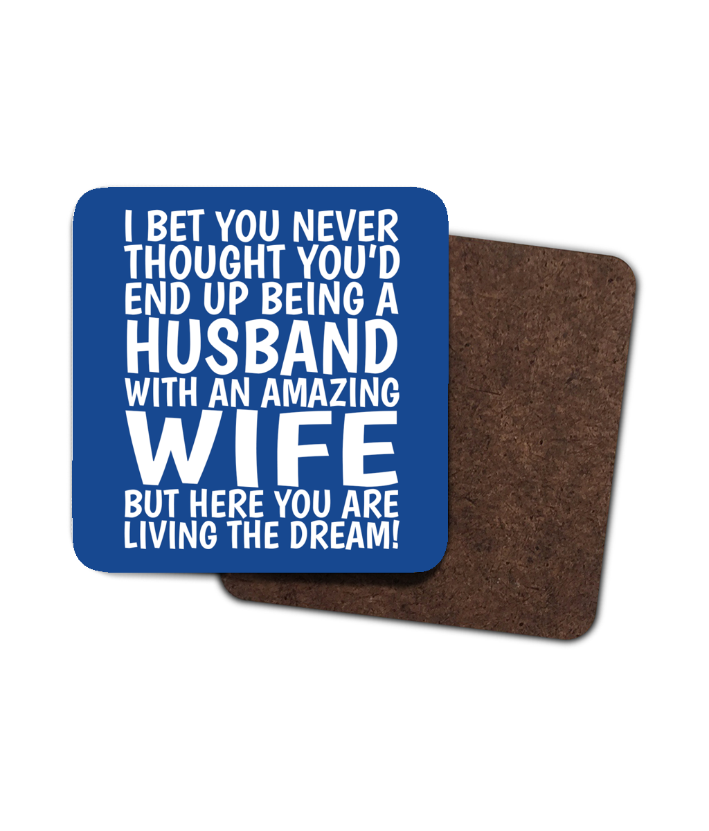 Funny blue coaster for husband with quote “I bet you never thought you’d end up being a husband with an amazing wife.”