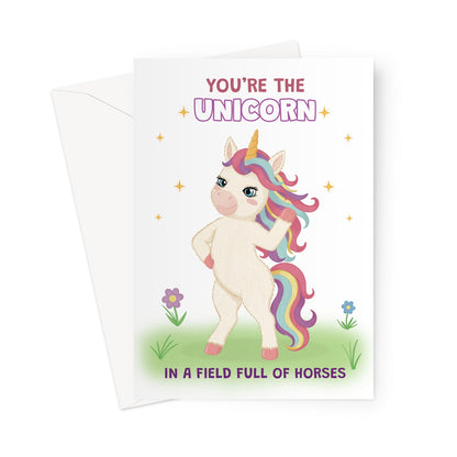 cute unicorn birthday card with rainbow mane and you’re the unicorn in a field full of horses message