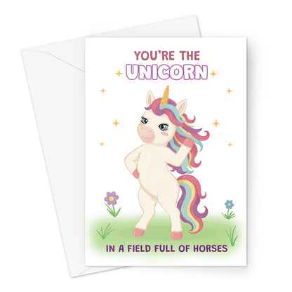 cute unicorn birthday card with rainbow mane and you’re the unicorn in a field full of horses message